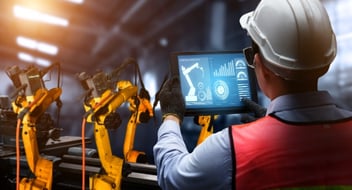 Asite_Blog_Evolution_4.0_Are_construction_jobs_at_risk_from_AI_Robotic_arm_tablet