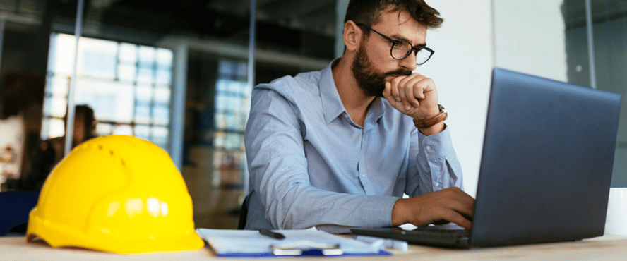 Asite_Blog_What_New_Laws_&_Rules_Are_Impacting_UK_&_Dutch_Construction_hard_hat_laptop