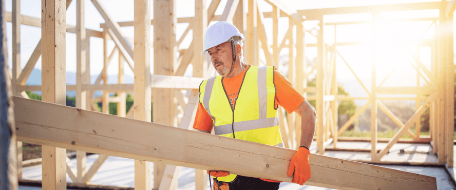 Asite_blog_Will_Construction_Building_Materials_Prices_Rise_or_Fall_in_2023_wood_house_worker